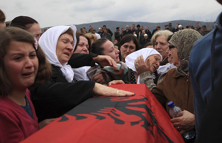 20 Photos: Kosovo Albanians mourn during a reburial ceremony in Krusha e Vogel