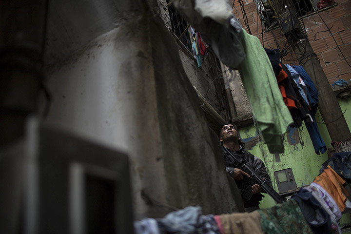 20 Photos: A military police officer during an operation in the Mare slums of Rio