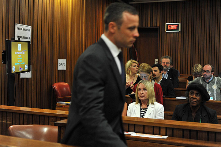 20 Photos: Oscar Pistorius arrives in the dock during his murder trial in Pretoria