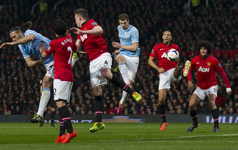 20 Photos: Manchester City's Dzeko scores his second goal against Manchester United