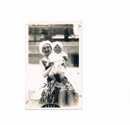 Mother with baby on beach in 1932