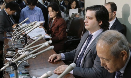 Mt. Gox CEO Mark Karpeles, sitting at second right,  attends a press conference at the Justice Ministry in Tokyo, where he apologised for his company's collapse.