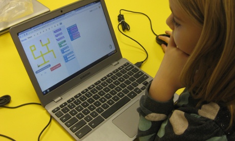 child coding a computer game