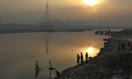 Men on banks of Yamuna River Delhi