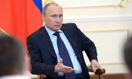 Russian president Vladimir Putin attends a news conference on the Ukraine crisis