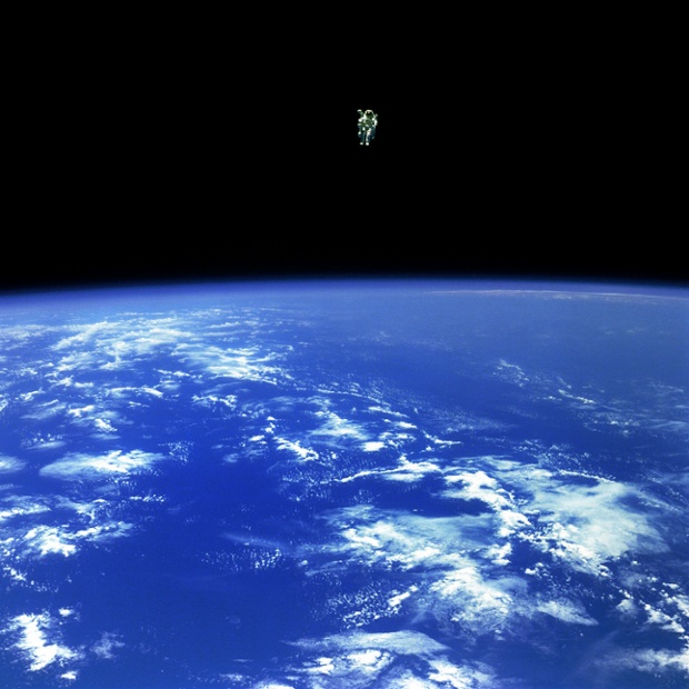 Mission Specialist Bruce McCandless II, is seen further away from the confines and safety of his ship than any previous astronaut has ever been