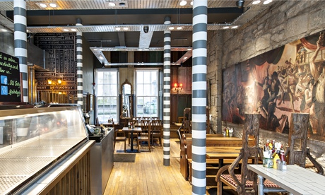 Old Salty's dining room with a tiled table and tall chairs