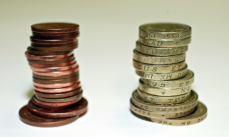 Piles of coins: pound and pence