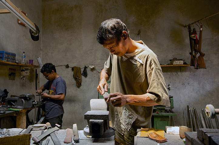 Air rifle capital: Gunsmiths work in a small air rifle factory