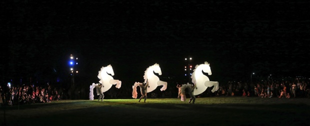 Giant inflated stallion puppets prance and perform during the Enlighten Festival in Canberra, Australia.