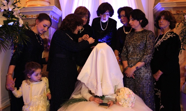 Orthodox Jewish bride Mussie Oberlander, is surrounded by relatives during her wedding ceremony in Budapest, Hungary.