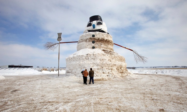 People look at a 50-foot snowman named 