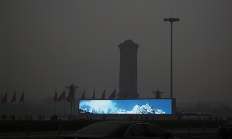 A LED screen shows the blue sky in Tiananmen Square during dangerous levels of air pollution in Beijing in February 2014