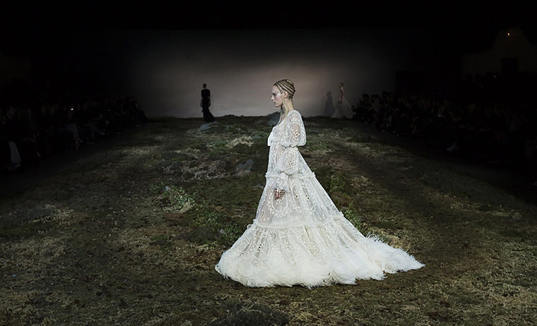20 Photos: A model presents a design by Sarah Burton during Paris fashion week