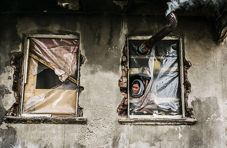 20 Photos: A Syrian refugee woman in the Kucukpazar area of Istanbul