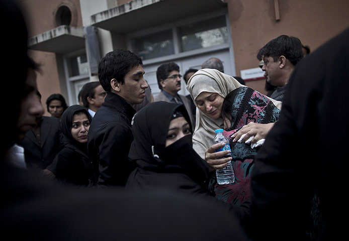 20 Photos: A Pakistani woman mourns the death of her daughter in Islamabad