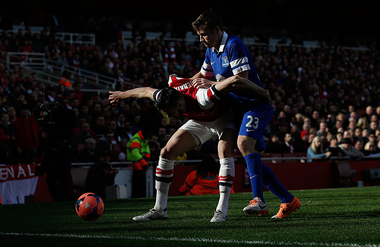Arsenal versus Everton: Carl Jenkinson blocks off Seamus Coleman