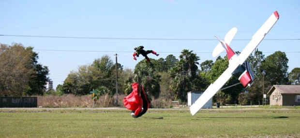 A plane nosedives into the ground after getting tangled with a parachutist at an airport in Mulberry, Florida.