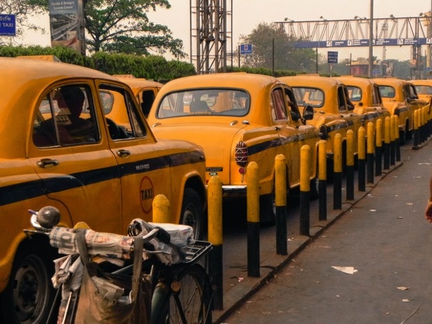 Bike or taxi? A rank of awaiting vehicles in Kolkata.