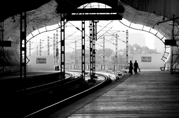 'Indian railways is one of the largest networks of trains in the world transporting 10's of millions of passengers daily. This is a shot of a train station along the Mass Rapid Transport System line in Chennai, India'