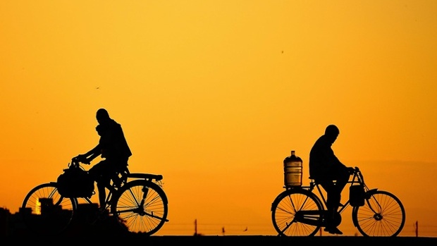 'This picture is taken in the vaigai river foot bridge in Madurai City on a evening. The bridge is mostly used by pedestrians, cyclists, motorcycles and small vehicles. Mostly the bridge is used by daily wage earners.'