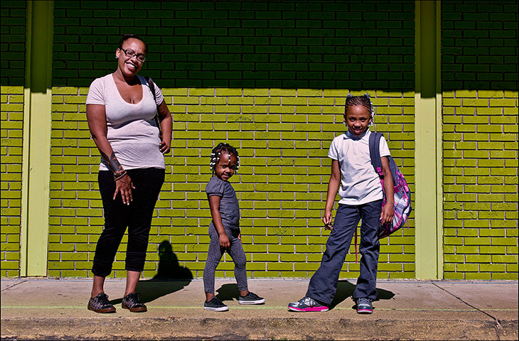 Pennsylvania: A mother and her children wait for a laundromat to open