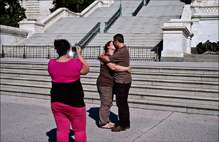 Pennsylvania: A couple kiss in front of the Capitol building