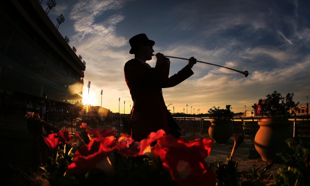 Bugler Jay Elmore warms up for the Call to the Post for the thoroughbred horse racing season-opener at Lone Star Park at Grand Prairie in Texas.