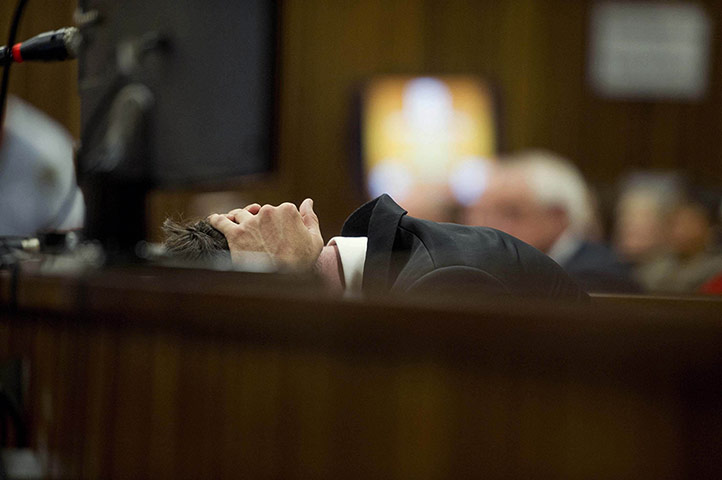 20 Photos: Oscar Pistorius reacts to evidence by a pathologist at the murder trial