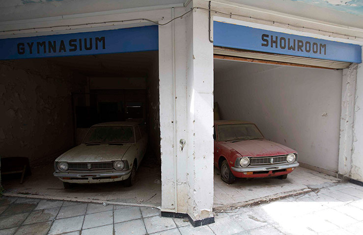 From the agencies: Cars sit abandoned in the United Nations buffer zone in central Nicosia