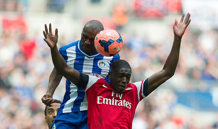 FA Cup semi: Wigan Athletic's Emmerson Boyce gets the better of Arsenal's Yaya Sanogo