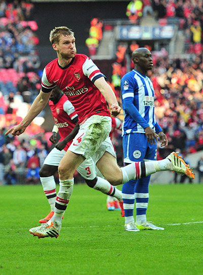 FA Cup semi: Arsenal's German defender Per Mertesacker celebrates