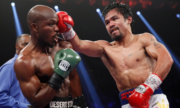 Manny Pacquiao hits previously undefeated WBO welterweight champion Timothy Bradley in taking back the title he