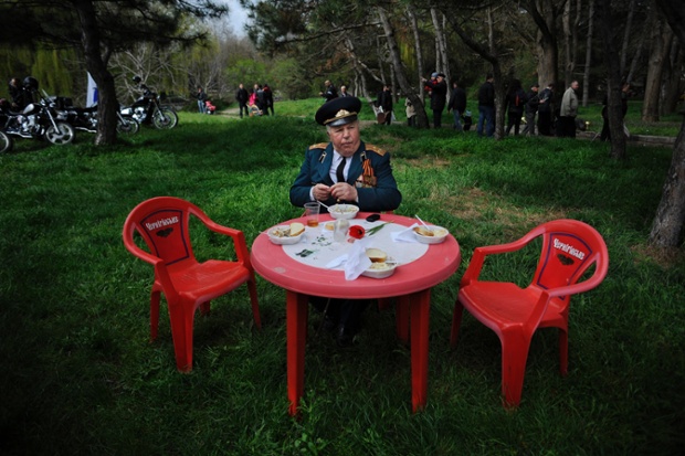 A second world war veteran sits during a celebration of the 70th anniversary of the liberation of Simferopol, Crimea.