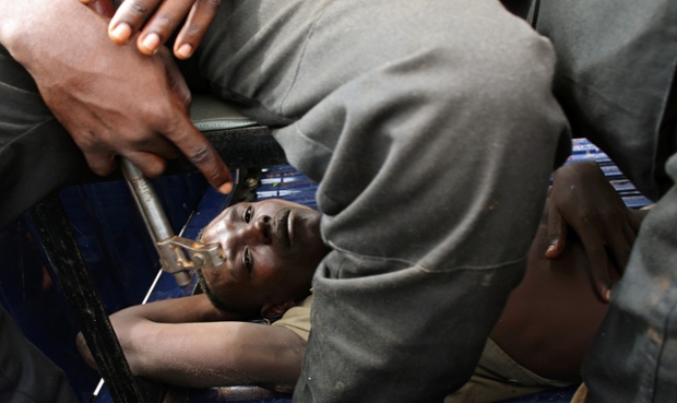 A detained man lies in a truck during a joint patrol of Central African Republic gendarmes, French gendarmes and French soldiers in Bangui.
