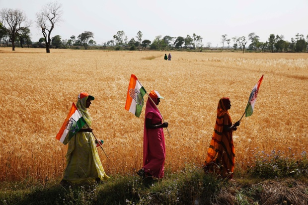 Congress party supporters walk home after attending a rally in the northern Indian state of Uttar Pradesh, as the multiphase voting across the country continues.