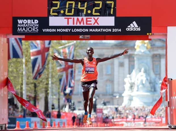 Wilson Kipsang of Kenya crosses the finish line to win the men's elite race at the Virgin London Marathon.