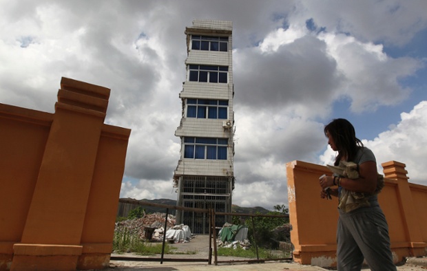 Zheng Meiju outside her nail house in Rui'an, Zhejiang province