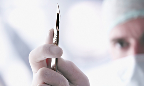 Doctor holding a scalpel 