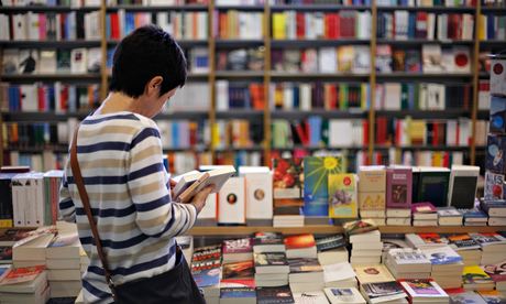 woman reading in bookshop