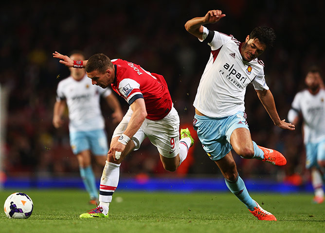Arsenal v West Ham: Lukas Podolski evades James Tomkins 