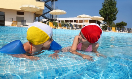 Children playing in a hotel pool