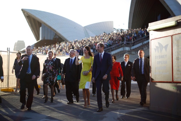 Prince William and Catherine, Duchess of Cambridge, walk from a reception at the Sydney Opera House  during their official visit to New Zealand and Australia with their son, Prince George.