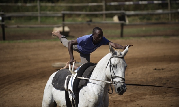 Musa Mugulega practices tricks at a lesson at the Soweto Equestrian Centre.