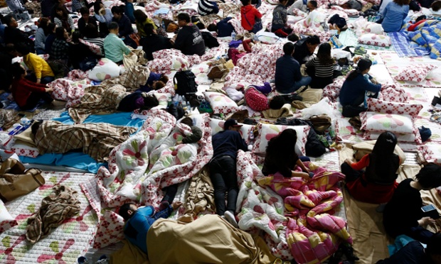 Anxious relatives of missing passengers on the sunk Sewol ferry wait for information on the missing at the Jindo gymnasium on Jindo Island, South Korea.