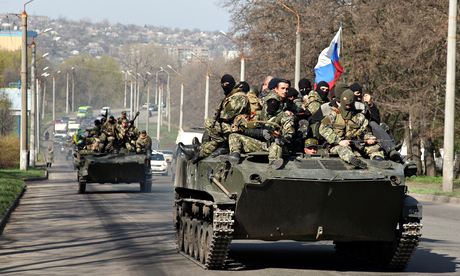 Men wearing military fatigues in the eastern Ukrainian city of Kramatorsk