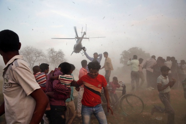 Electioneering in style: A helicopter carrying Nagma, Bollywood actress and Congress party candidate for Meerut, takes off after attending an election rally near Allahabad, India. Indians cast their ballots on the biggest day of voting in the country's week long general election.