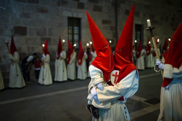 Penitents take part in the Procesion del Silencio during Holy Week in Zamora, Spain.