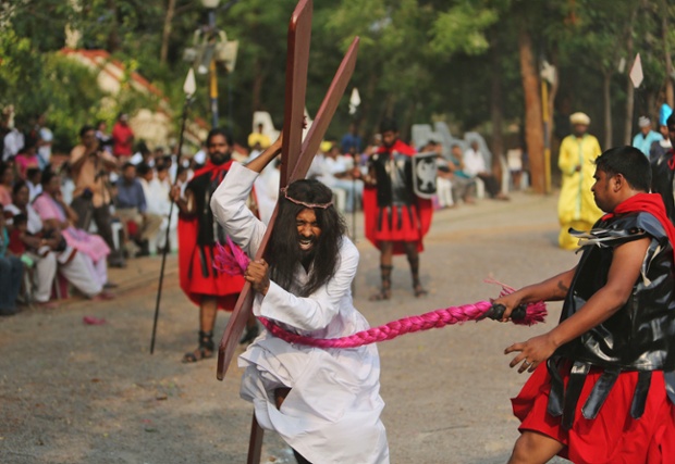 An Indian Christian devotee enacts the crucifixion to mark Good Friday at The Mount Carmel Church in Hyderabad, India.