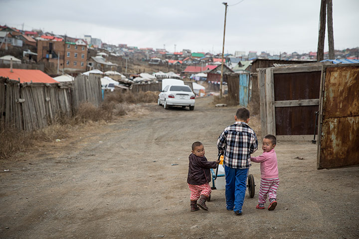 Mongolia gallery: Children cart water in the Bayan Khoshuu district in the north of Ulan Bato